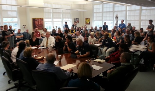 The Lusher Charter School board was surrounded by teachers and others to hear about the union issue on April 16. A similar crowd filled the board's meeting room on Saturday, May 21. (UptownMessenger.com file photo by Robert Morris)