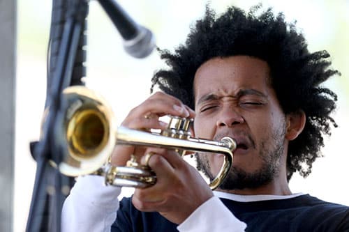 Xavier Molina plays his trumpet with the Dominic Minix Quartet on the Loyola University stage at the 2016 Freret Street Festival. The event featured 18 artists on three stages, 35 food vendors and craft vendors ranging from Freret and Soniat to Napoleon Avenue. (Zach Brien, UptownMessenger.com)