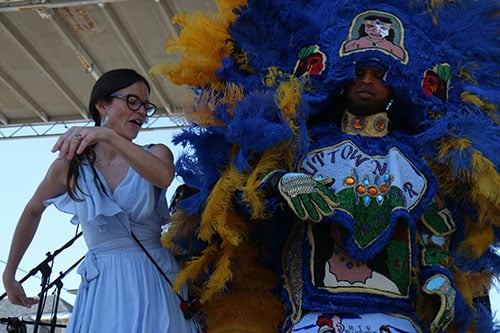 Rebeca Trejo, left, dances with the Wild Magnolias on the Alder Hotel stage at the 2016 Freret Street Festival. The event featured 18 artists on three stages, 35 food vendors and craft vendors ranging from Freret and Soniat to Napoleon Avenue. (Zach Brien, UptownMessenger.com)