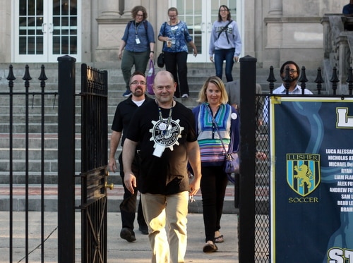 Members of the United Teachers of Lusher exit the building following Tuesday's vote on the union issue. (Robert Morris, UptownMessenger.com)