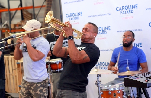 The Brass-a-holics perform at the Caroline Fayard rally.