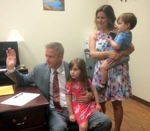 Surrounded by his family, Ben Kleban files to run for a seat on the Orleans Parish School Board. (Robert Morris, UptownMessenger.com)