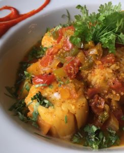 Jamaican Scalllops in pineapple juice, jalapeños, onions, bell peppers, tomatoes, and piri piri sauce (Kristine Froeba)