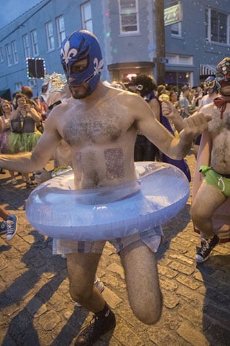 San Juan of the El Lucha Krewe dances his way down Oak Street during Mid Summer Mardi Gras. The Krewe of O.A.K. celebrated the 30th anniversary of Mid Summer Mardi Gras with the theme "Get Wet". (Zach Brien, UptownMessenger.com)