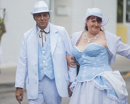Norman, left, and Christine Smith, right, show off their home made seersucker costumes. The Krewe of O.A.K. celebrated the 30th anniversary of Mid Summer Mardi Gras with the theme "Get Wet". (Zach Brien, UptownMessenger.com)