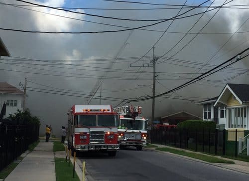 Firefighters battle a blaze in the 4200 block of South Rocheblave. (Zach Brien, UptownMessenger.com)