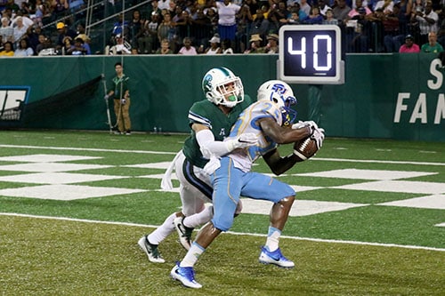 Senior defensive back Richard Allen strips the ball from Southern wide receiver Willie Quinn, forcing a touchback and a turnover. Tulane defeated Southern University 66 to 21 at their home opener at Yulman Stadium. (Zach Brien, UptownMessenger.com)