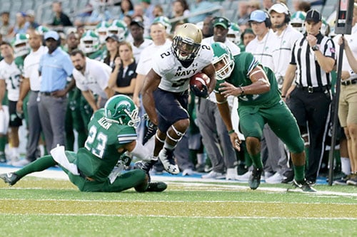 Navy running back Toneo Gulley shakes a tackle from Tulane defensive back Richard Allen. Navy defeated Tulane 21-14 at Yulman Stadium. (Zach Brien, UptownMessenger.com)