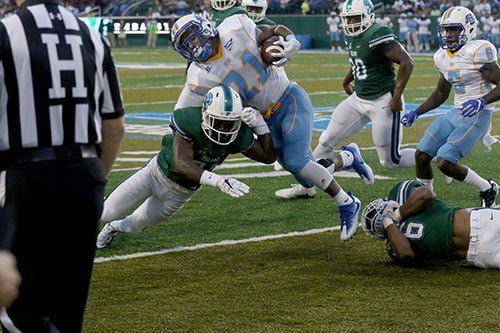 Donnie Lewis Jr., Tulane defensive back, up ends Southern running back Leonard Tillery during a run in the first quarter. Tulane defeated Southern University 66 to 21 at their home opener at Yulman Stadium. (Zach Brien, UptownMessenger.com)