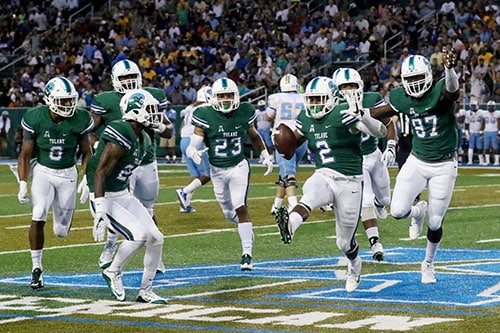 Tulane linebacker Nico Marley, center, celebrates a forced fumble in the first half. Tulane defeated Southern University 66 to 21 at their home opener at Yulman Stadium. (Zach Brien, UptownMessenger.com)