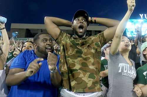 Trevarius Hopkins and La'travion Jackson celebrate a Tulane touchdown in the student section of Yulman Stadium. Tulane defeated Southern University 66 to 21 at their home opener at Yulman Stadium. (Zach Brien, UptownMessenger.com)