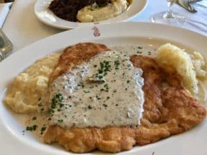 Canal Street Bistro JagerSchnitzel with Mushroom Cream Sauce, Kartoffelbrie and Sauerkraut Kristine Froeba)