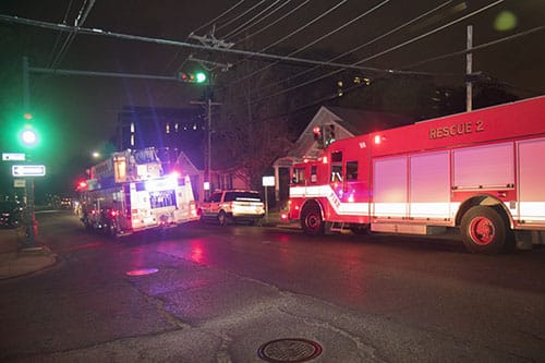 NOFD trucks gather at the corner of Freret and Calhoun near the site of a fire that broke out at 2119 Calhoun street. All of the residents were able to escape the residence without harm, but the building itself was substantially burned.